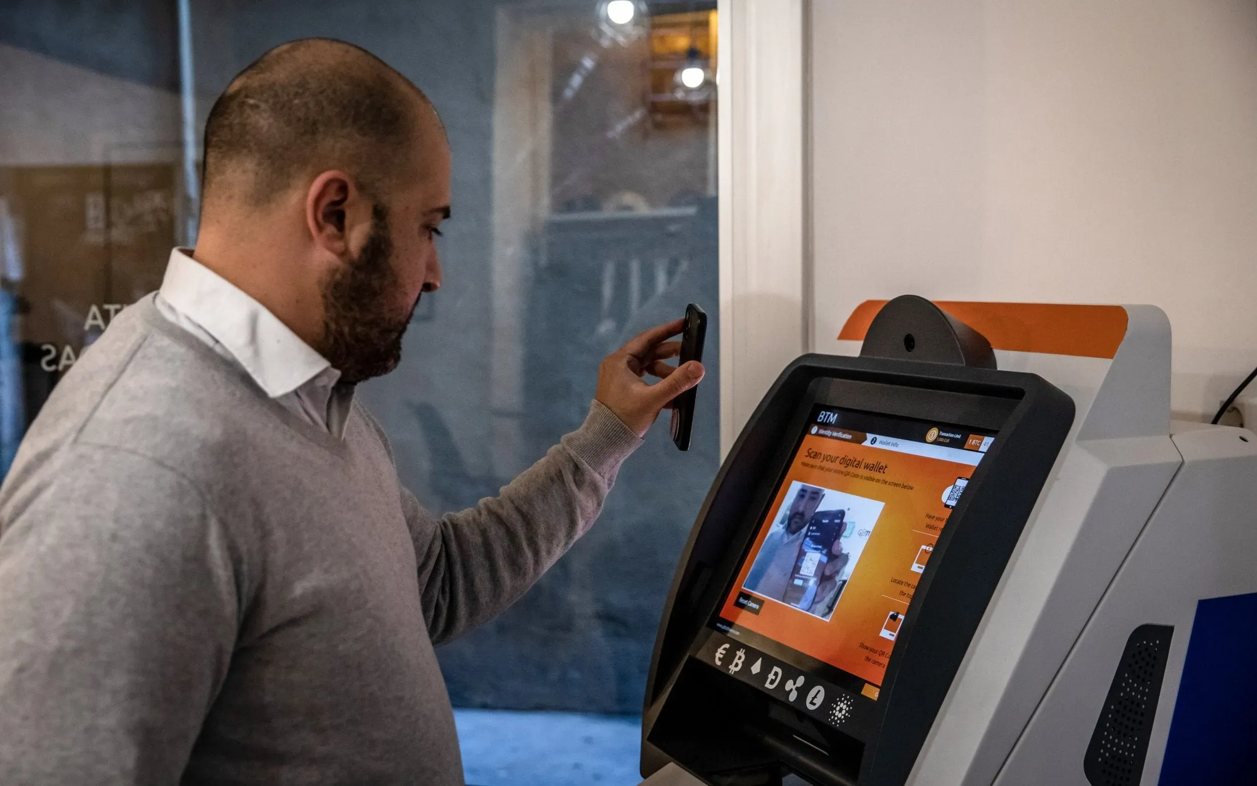 customer using a bitcoin atm