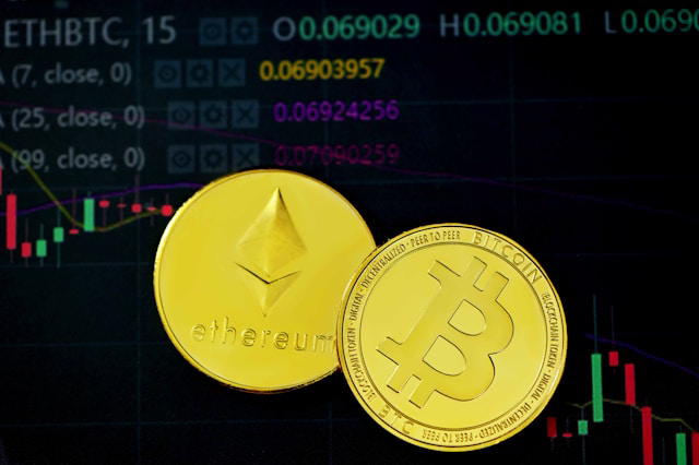 ethbtc trading interface with physical coins laid on top of a screen