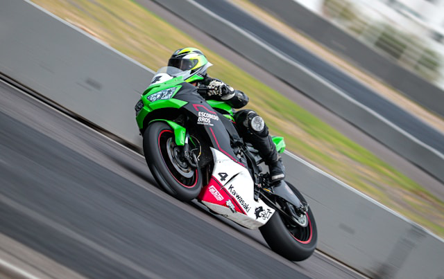 person riding motorcycle on a track