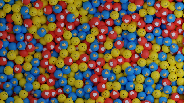 balls with smiley faces, hearts and thumbs up icons